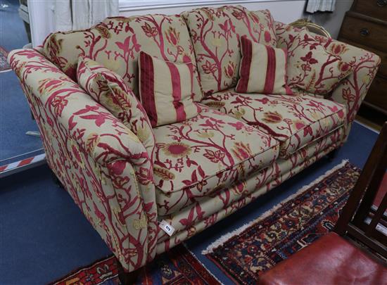 An upholstered deep seated two seater settee W.200cm